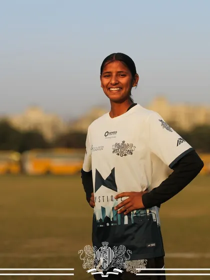 A smile of a champion. This player's happiness reflects the positive and successful environment of the team.
