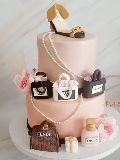 A super gorgeous no-fondant cake for fashionista Aditi's 40th birthday. She loves luxury brands, so I created this two-tier cake adorned with her favorite things: Fendi, Dior, Gucci, and a stylish heel.
