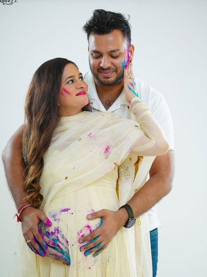 A loving look shared between the couple during their colorful maternity session. This photo beautifully mixes the playful theme with the genuine romance between the parents-to-be.