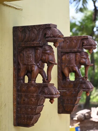 Another view of the paired elephant brackets, showing how they create a symmetrical and balanced look when placed on either side of a window or door.