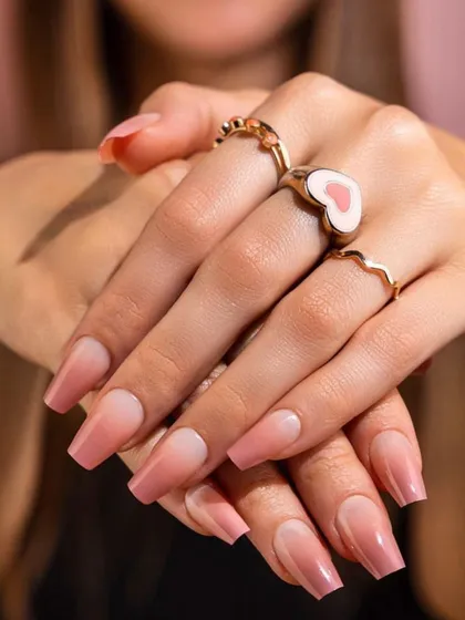 A perfect example of subtle elegance. This is a beautiful pink ombre effect on acrylic extensions, blending seamlessly from a soft nude base to a deeper pink tip. It’s a clean, sophisticated look that showcases my skill in creating flawless gradients.