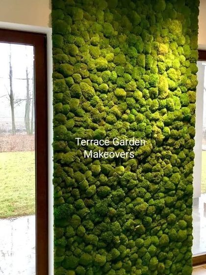 Here, I used preserved moss to wrap an interior column between two large windows. This transforms a simple structural element into a vibrant, green feature that connects the indoor space with the view outside.