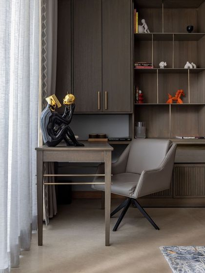 A closer look at a bespoke study area, where every element is thoughtfully designed for both form and function. The integrated shelving and minimalist desk provide a clean, organized workspace that complements the room's serene aesthetic.