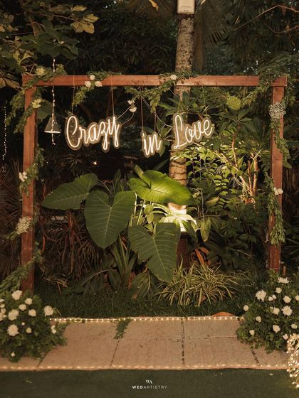 A close-up of the "Crazy in Love" neon sign. This detail shot shows how you can personalize our space with unique decor elements for your event.