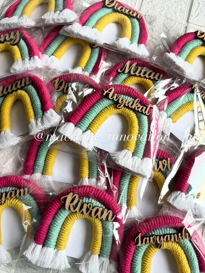 A closer look at a batch of custom rainbow magnets being prepared for a bulk order. The vibrant colors and personalized names make them a delightful gift.