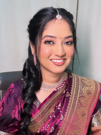 A beautiful look for a Shrimant Puja. The makeup is elegant and traditional, perfect for this sacred ceremony.