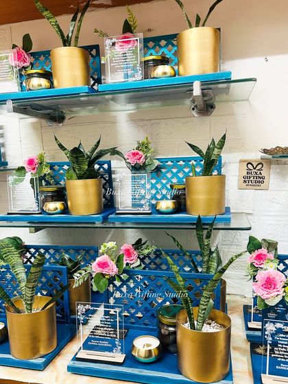 Another view of the gratitude hampers, showing the beautiful contrast between the blue jaali platter and the pink flowers.