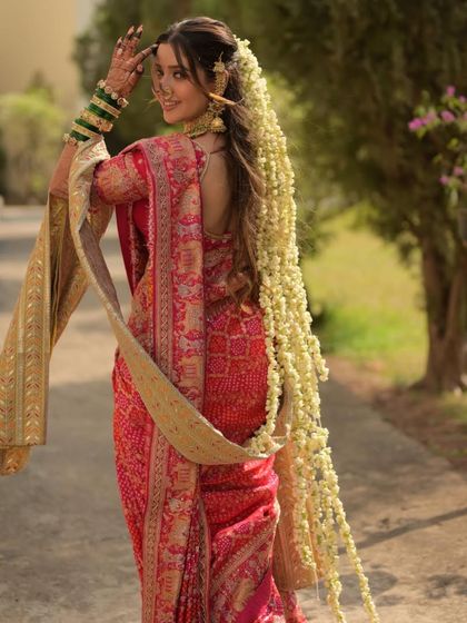 The long trail of jasmine flowers in her hair is a classic element of bridal beauty. I ensured her makeup was soft and romantic to match this beautiful, traditional hairstyle.