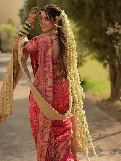The long trail of jasmine flowers in her hair is a classic element of bridal beauty. I ensured her makeup was soft and romantic to match this beautiful, traditional hairstyle.