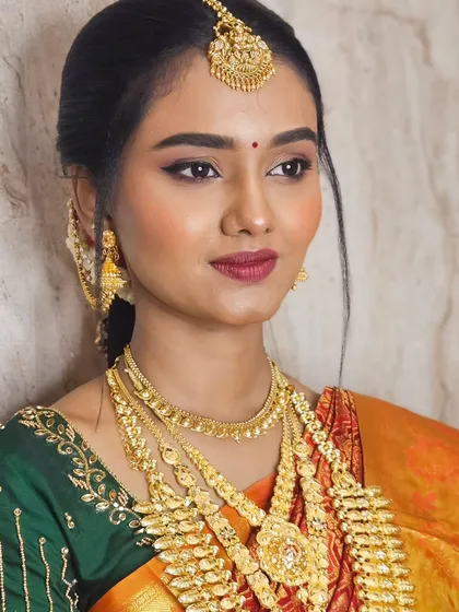 A close-up of Soundariya's muhurtham look, showing the perfect winged eyeliner and the rich lip color that complements her traditional attire.