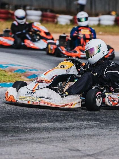 Our driver in the number 75 kart, focused on the apex of a corner.