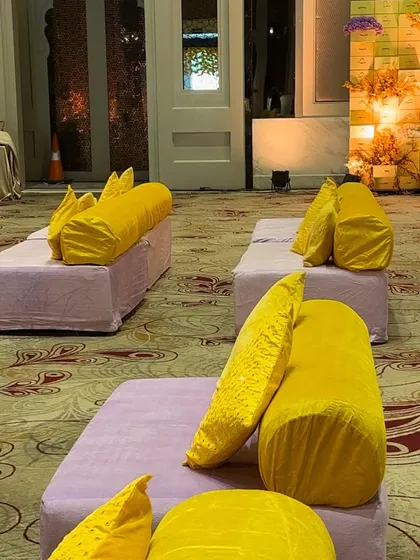 A detail of the comfortable and colorful floor seating. We use a combination of mattresses, bolsters, and cushions to create a relaxed and inviting atmosphere for guests at Mehendi and Haldi events.