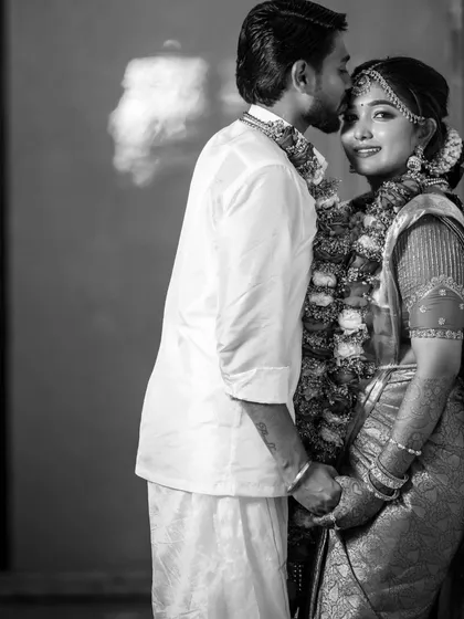A black and white photo of a couple, which gives a timeless and classic feel to their wedding day portrait.