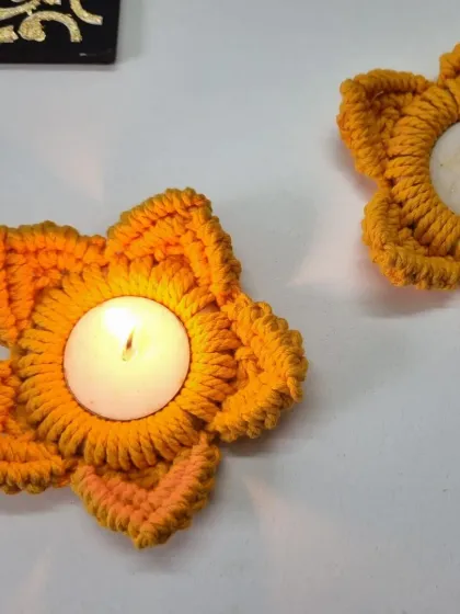 Two of my orange flower tealight holders, creating a beautiful, warm ambiance. They make wonderful gifts for the festival of lights.