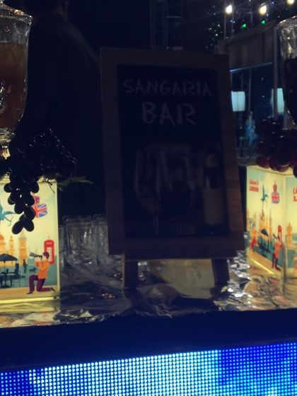 A London-themed Sangria bar. The bases of the drink dispensers are illuminated with custom graphics, tying the bar perfectly into the event's theme.