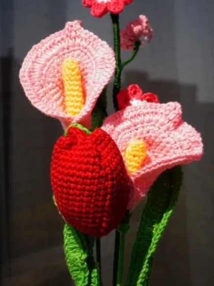 A close-up of my crochet flower arrangement, perfect for Valentine's Day or any day you want to show some love. This bouquet features calla lilies and a tulip.