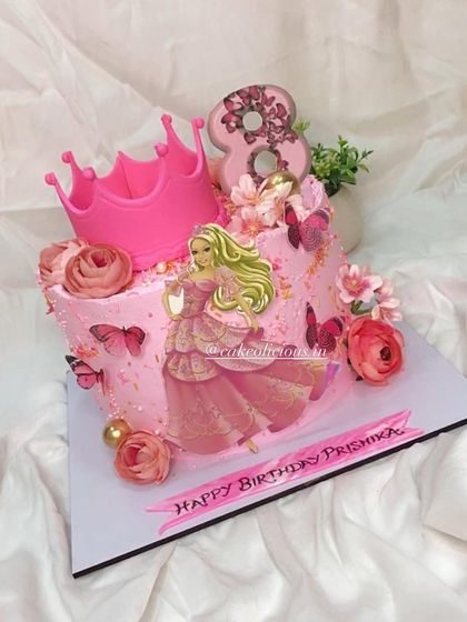 Another view of the glamorous Barbie-themed birthday cake, showcasing the floral and butterfly details.