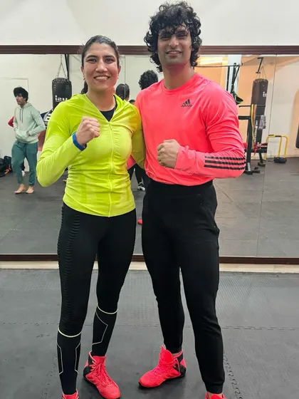 Two high-level boxers posing together during our special workshop event.