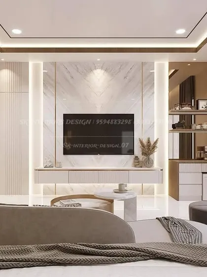 A bedroom entertainment center that doubles as a vanity. This design features a floating TV console, open shelving, and a compact dresser with drawers, all illuminated with soft backlighting.