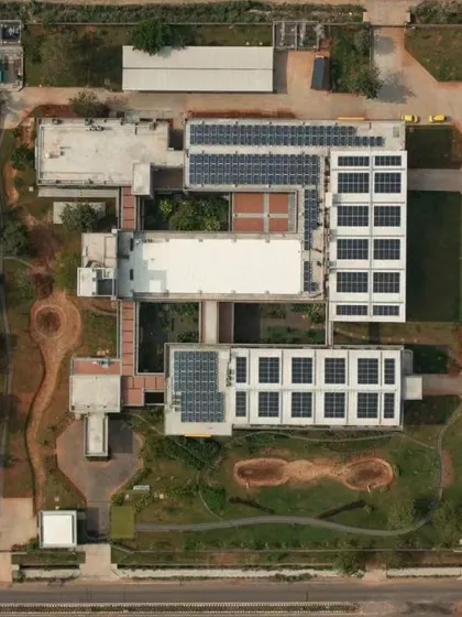 This aerial view shows the scale of our sustainable design for the Fanuc India factory in Chennai. We integrated large arrays of solar panels on the rooftops to maximize energy efficiency. The layout also includes green spaces and courtyards, demonstrating how industrial architecture can coexist with and benefit from bioclimatic design principles.