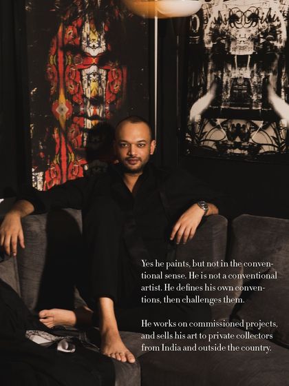 A moody portrait of artist Pushkar Thakur, seated amongst his powerful, large-scale artworks. The image and accompanying text delve into his unconventional approach to art, capturing his unique creative identity.