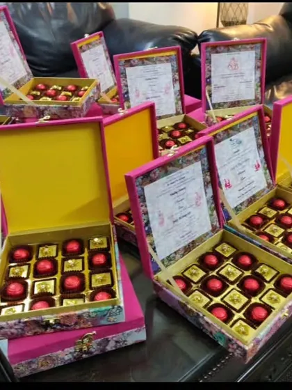For a sweet and simple wedding invitation, I created these lovely floral boxes filled with my handmade chocolates. The inside of the lid features the full wedding invitation details, combining the invite and the gift in one.