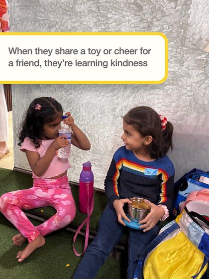 When they share a toy or cheer for a friend, they're learning kindness. These two girls are sharing a quiet moment, showing the simple, beautiful friendships that form at our club.