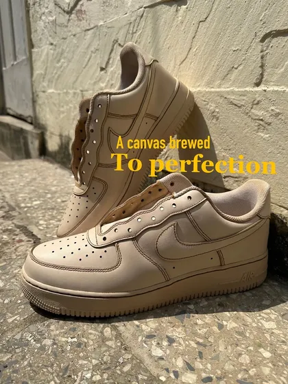 The first step in the process: a blank canvas brewed to perfection. This is a pair of white Air Force 1s after being dipped in coffee, ready for some art.