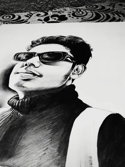Another angle of my self-portrait. The use of charcoal creates deep blacks, which makes the portrait very striking.