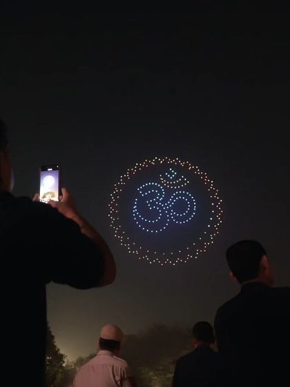 A guest captures the sacred 'Om' symbol, created by our drones during the Dilli Deepotsav. It was a moment where technology and spirituality met, creating a serene and powerful experience for all.