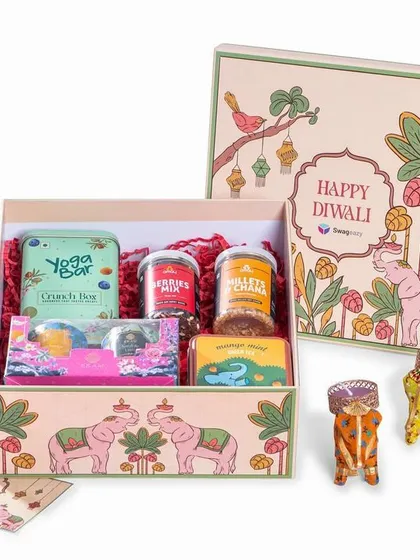 A product-on-white shot of an illustrated Diwali gift box from Swageasy. This clean presentation highlights the beautiful packaging and the variety of items inside.