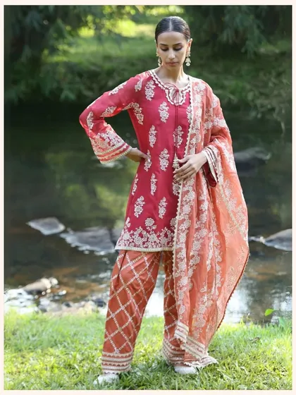 Another look at this stunning red kurta set, perfect for Karwa Chauth or a wedding. The combination of the embroidered kurta and printed salwar is so eye catching.