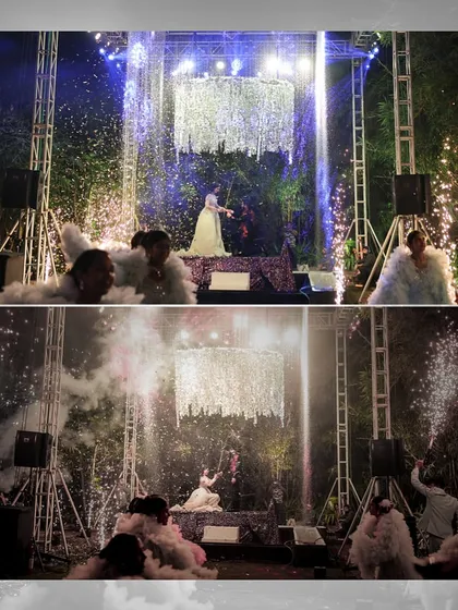 A bride's solo performance on a stage with a crystal chandelier, surrounded by dancers and pyrotechnics. We create these show-stopping moments for the bride or groom.