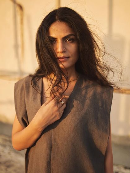 A simple, direct portrait where the warm sunset light and gentle breeze create a beautiful, natural look.