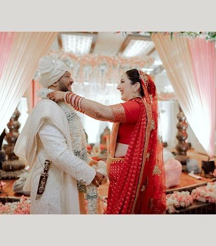 The varmala ceremony, where the bride places the garland on the groom. A joyful and important ritual that marks the beginning of their wedding.