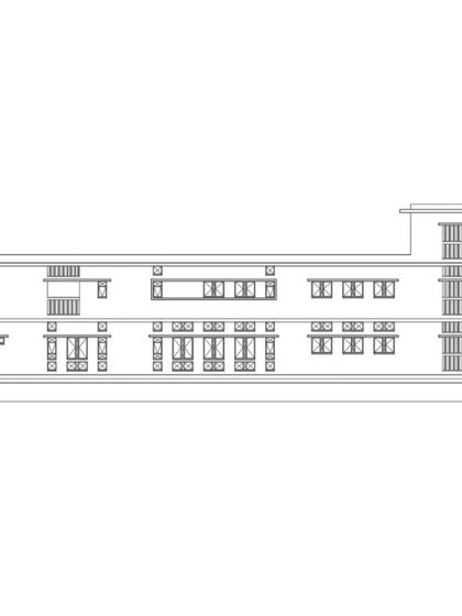The rear elevation of Buddhi School, showcasing a different arrangement of windows and openings tailored to the building's orientation and function.