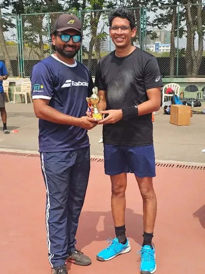 Another key player from our men's team receiving his trophy after the win.