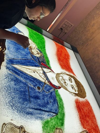 Another angle of the Gukesh Dommaraju tribute, this time with the Indian tricolor in the background, celebrating his achievement as a victory for the entire nation.