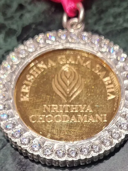 The other side of the Nritya Choodamani medal, bearing the name of the prestigious Krishna Gana Sabha. This award holds a special place in my heart.