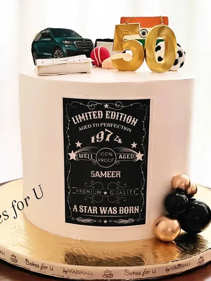 A "Limited Edition" cake for a 50th birthday, themed like a vintage label. The design includes personal details like the birth year and is topped with a car and sports equipment.