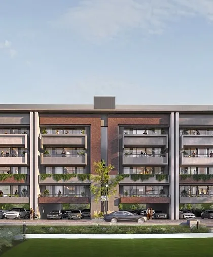 This street-level view of Gulnaar Lifestyle shows how the design fosters community living with accessible green spaces and interconnected buildings.
