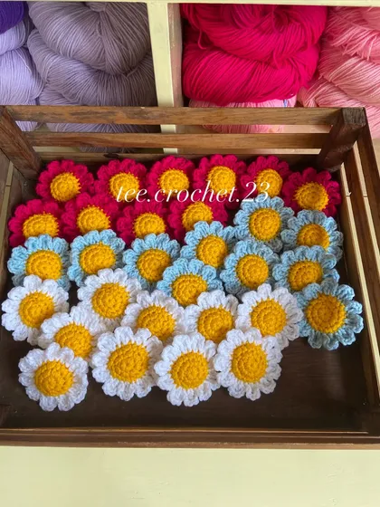 A crate of colorful daisy heads, another versatile option for decor or keychains.