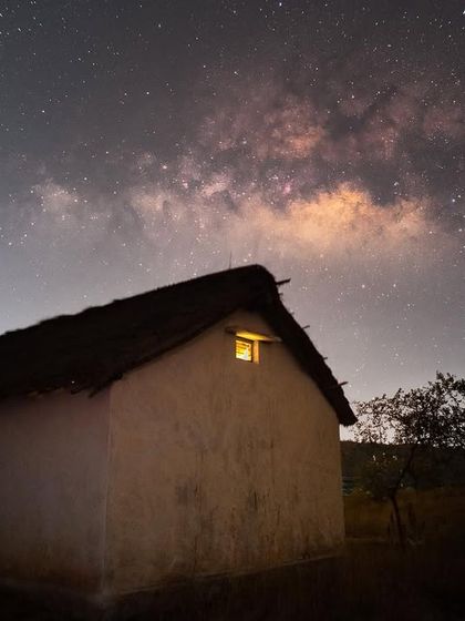 The galactic core rising above a small hut in the Kalpavalli conservation area. This image also serves as a statement about the impact of light pollution on our ability to see the stars.