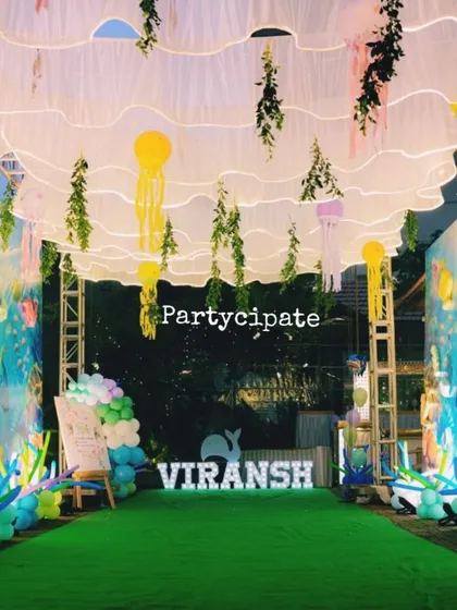I love transforming a space completely. For this 'Under the Sea' party, we created an immersive underwater walkway with flowing ceiling drapes, hanging jellyfish, and sea-themed decor to make guests feel like they were diving into the ocean.