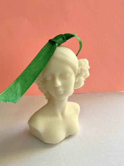 The pretty 'Lady' candle, handcrafted in soy wax. This elegant sculptural piece can be customized with different colors or ribbons for bulk orders, wedding favors, or party gifts.
