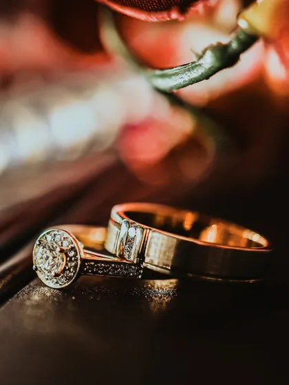 A symbol of a lifelong promise. This detailed shot of the wedding rings showcases my focus on every element of your day. I believe that even the smallest details, like the cut of a diamond and the texture of the bands, are part of your grand story and deserve to be captured beautifully.