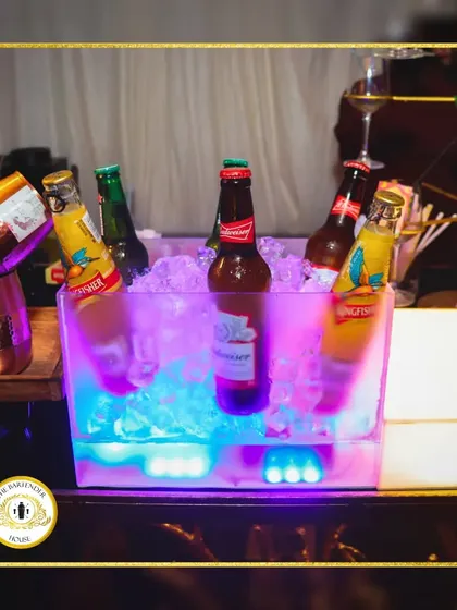 For the beer lovers, we always have a bucket of chilled favorites like Kingfisher and Budweiser ready to go. It's a simple pleasure, done right.