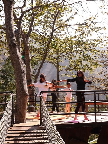 Opening the chest and shoulders on the suspension bridge. Being surrounded by the sounds of the Ganga and the Himalayan backdrop makes the experience of practicing together incredibly special.