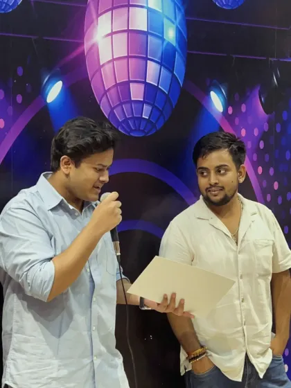 Another angle of Tejas receiving his certificate, a moment of pride for both student and teacher.