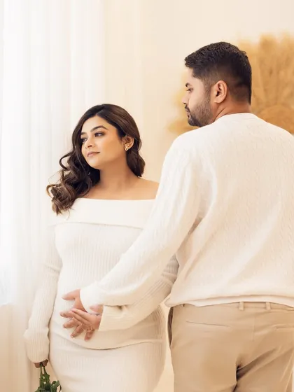A simple, gentle touch on the belly. This pose beautifully symbolizes the connection of both parents to their unborn baby.